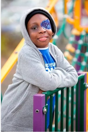 Nathaniel Nabena, smiling at a playground